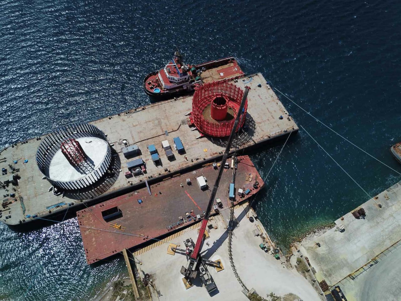 Load-out of the Hollanse Kust Zuid export cable onto a barge with cable carousels on board