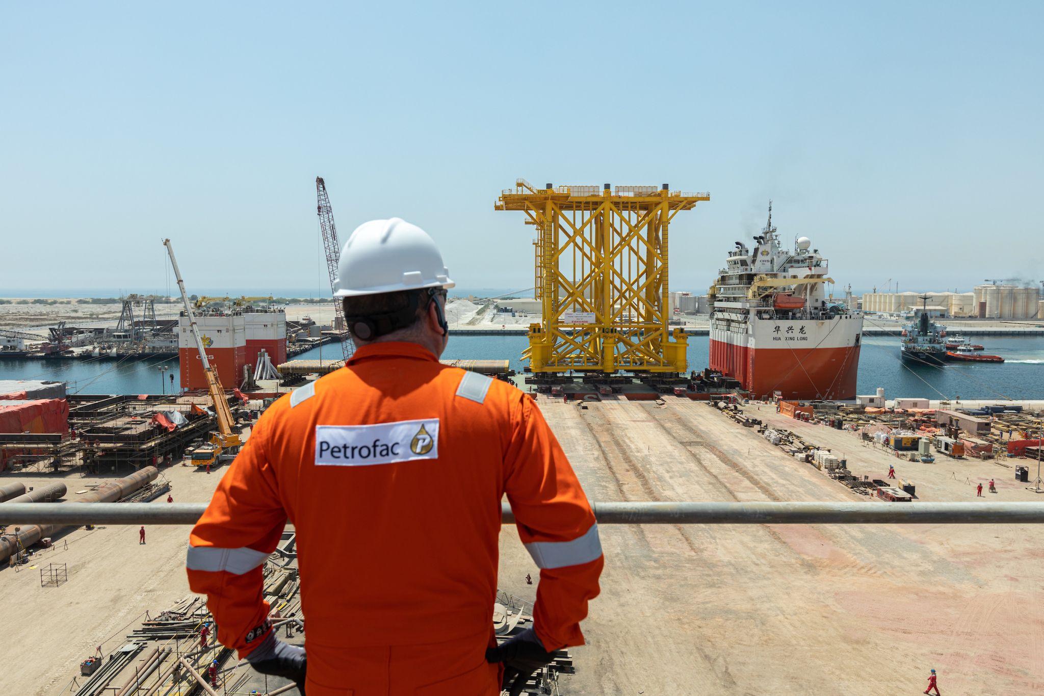 A photo of a Petrofac worker looking at the Hollandse Kust Beta jacket sailing out