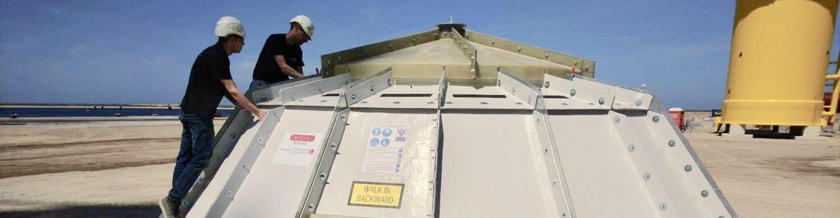 A photo of CCM team with monopile covers