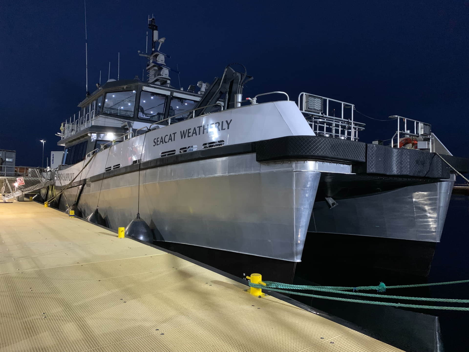 A photo of the catamaran Seacat Weatherly at dock at night