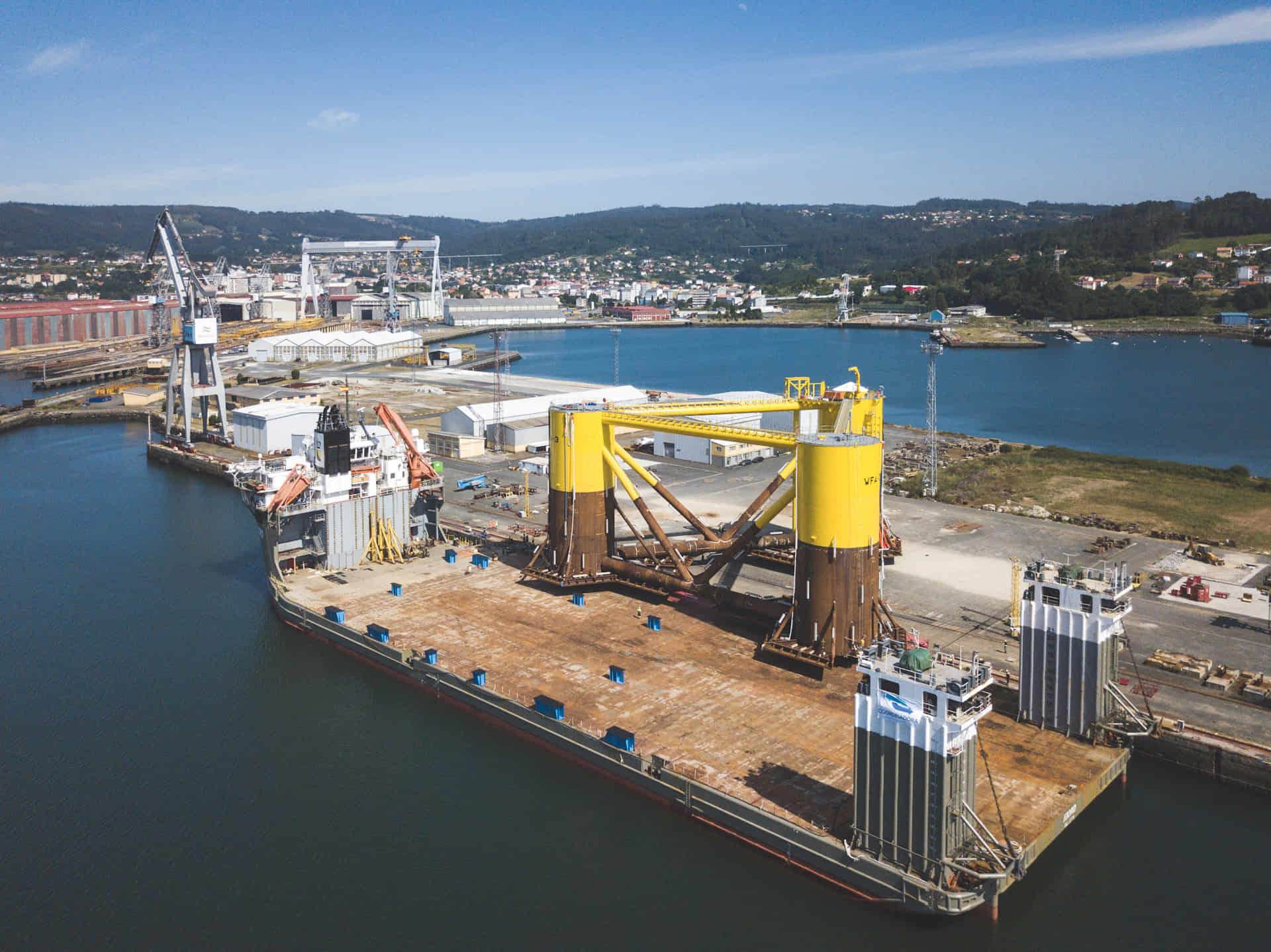 An areal photo of the WindFloat floating wind foundation at a dock