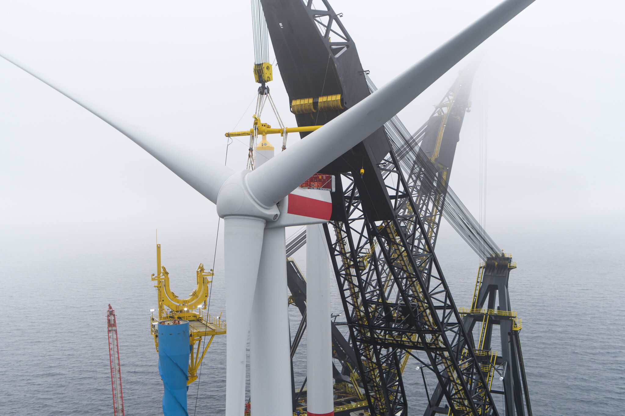 A photo of one of the turbines at Arcadis Ost 1 being installed, rotor hub in focus